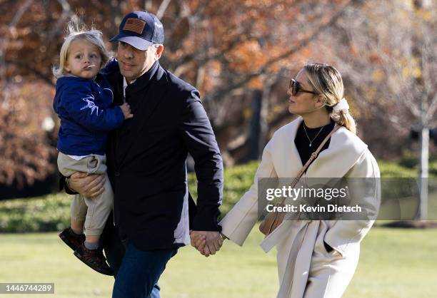 Hunter Biden, the son of U.S. President Joe Biden, holds his son Beau as he walks with his wife Melissa Cohen on the South Lawn of the White House on...