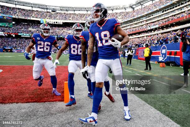 Isaiah Hodgins of the New York Giants celebrates after scoring a touchdown in the third quarter of a game against the Washington Commanders at...