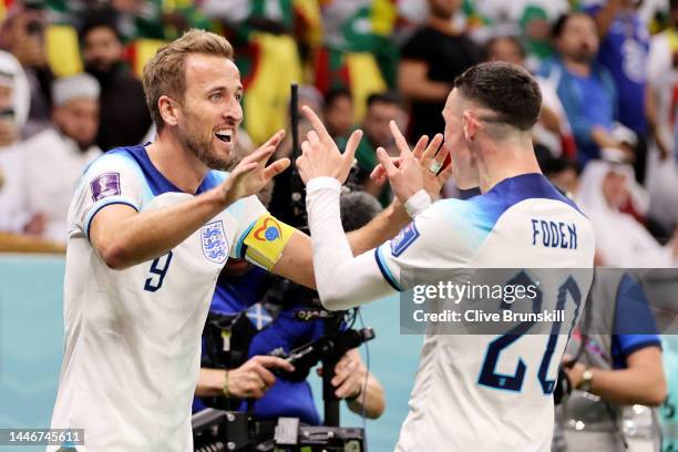 Harry Kane of England celebrates after scoring the team's second goal during the FIFA World Cup Qatar 2022 Round of 16 match between England and...