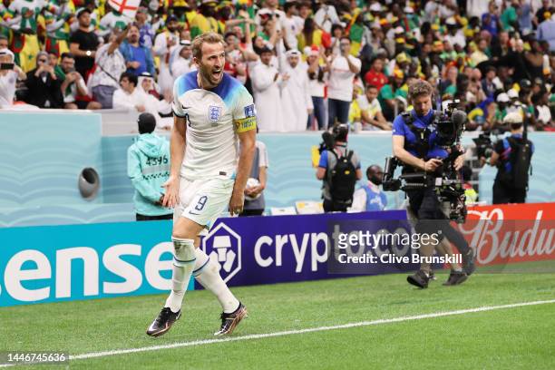 Harry Kane of England celebrates after scoring the team's second goal during the FIFA World Cup Qatar 2022 Round of 16 match between England and...