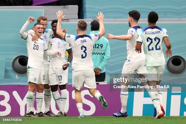 Harry Kane of England celebrates with teammates after scoring the team's second goal during the FIFA World Cup Qatar 2022 Round of 16 match between...