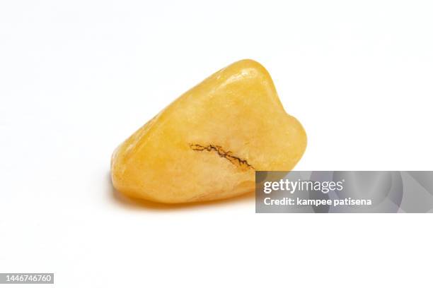 yellow agate rocks on white background - ônix - fotografias e filmes do acervo