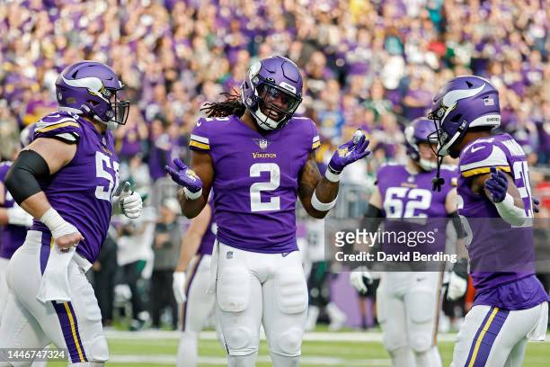 Alexander Mattison of the Minnesota Vikings celebrates after scoring a touchdown during the second quarter against the New York Jets at U.S. Bank...