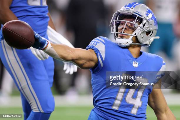 Amon-Ra St. Brown of the Detroit Lions celebrates a first down during the third quarter of the game against the Jacksonville Jaguars at Ford Field on...