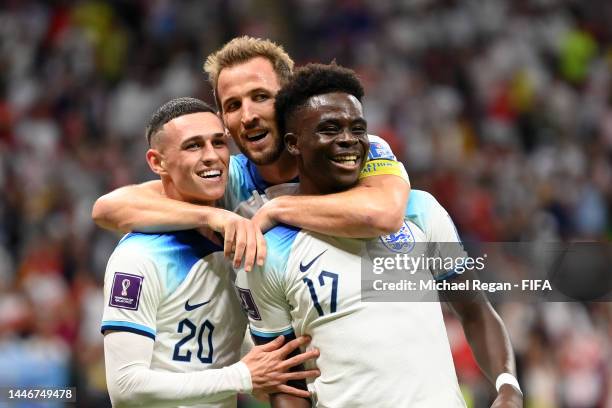 Bukayo Saka of England celebrates after scoring the team's third goal during the FIFA World Cup Qatar 2022 Round of 16 match between England and...