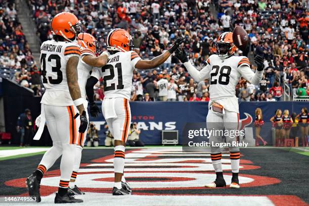 Denzel Ward of the Cleveland Browns celebrates with Jeremiah Owusu-Koramoah of the Cleveland Browns after Ward's fumble recovery for a touchdown...