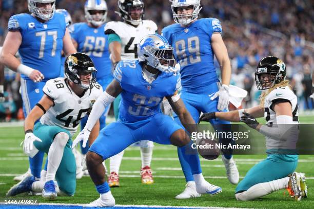 Andre Swift of the Detroit Lions celebrates after scoring a touchdown against the Jacksonville Jaguars during the third quarter at Ford Field on...