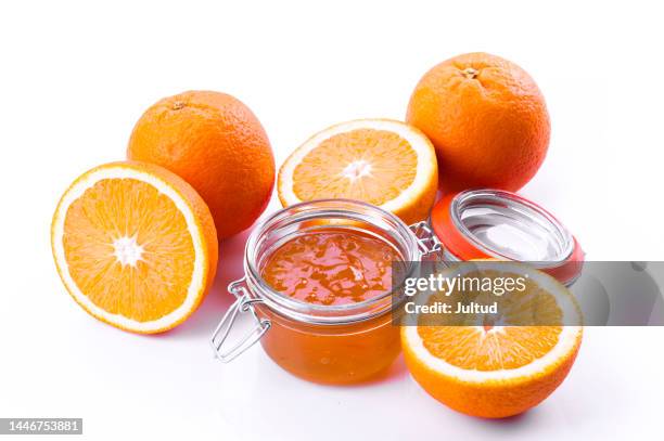 orange preserves jar, with fresh oranges around it - marmalade stock pictures, royalty-free photos & images