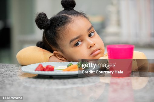 Upset toddler refuses to eat healthy meal because she is a picky eater Upset toddler refuses to eat healthy meal because she is a picky eater