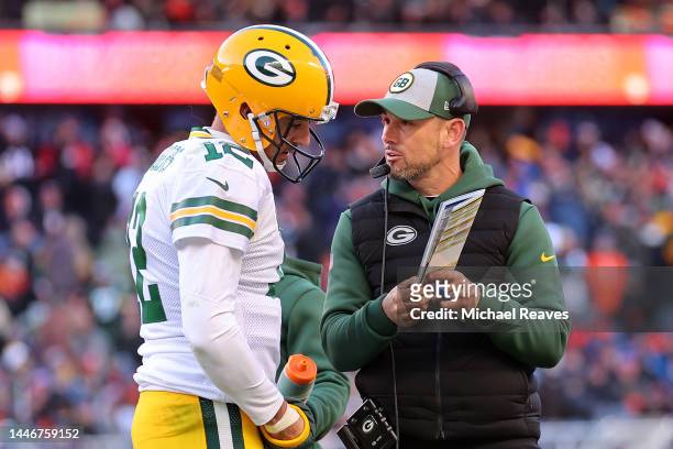 Aaron Rodgers of the Green Bay Packers and head coach Matt LaFleur talk during the second half of the game against the Chicago Bears at Soldier Field...