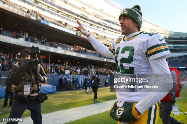 Aaron Rodgers of the Green Bay Packers waves to fans as he walks off the field after defeating the Chicago Bears at Soldier Field on December 04,...