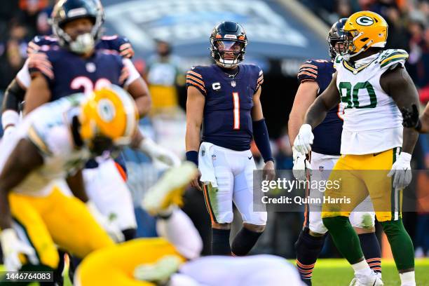Justin Fields of the Chicago Bears looks on after throwing an interception against the Green Bay Packers during the fourth quarter at Soldier Field...