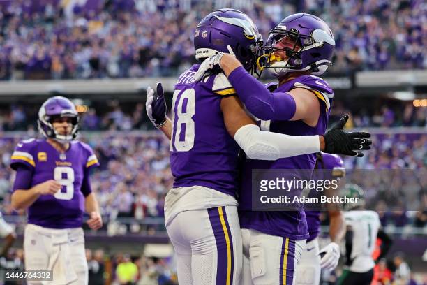 Justin Jefferson of the Minnesota Vikings and Adam Thielen of the Minnesota Vikings celebrate after Jefferson's touchdown during the fourth quarter...