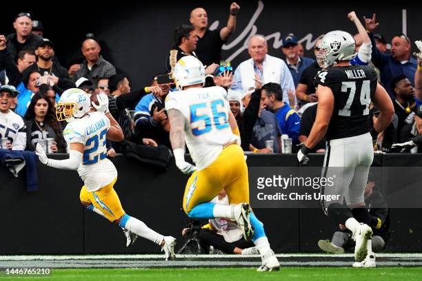 Bryce Callahan of the Los Angeles Chargers celebrates after returning an interception for a touchdown in the first quarter of a game against the Las...