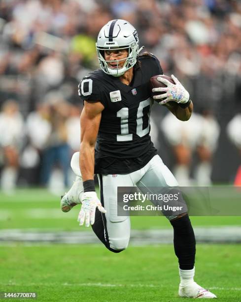 Mack Hollins of the Las Vegas Raiders runs with the ball in the second quarter of a game against the Los Angeles Chargers at Allegiant Stadium on...