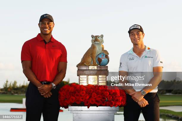 Viktor Hovland of Norway celebrates with the trophy and host Tiger Woods after winning during the final round Hero World Challenge at Albany Golf...