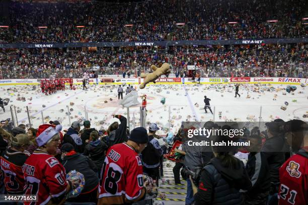 Plush toys are thrown onto the ice after the Calgary Hitmen score on the Moose Jaw Warriors during the 27th annual ENMAX Teddy Bear Toss game at the...