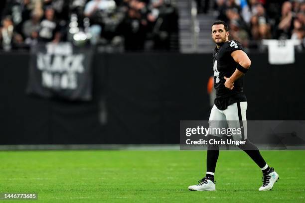 Derek Carr of the Las Vegas Raiders walks onto the field after a field goal in the second quarter of a game against the Los Angeles Chargers at...