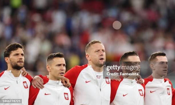 Bartosz Bereszynski, Przemyslaw Frankowski, Kamil Glik, Piotr Zielinski and Jakub Kiwior of Poland sing the National anthem prior to kick off in the...