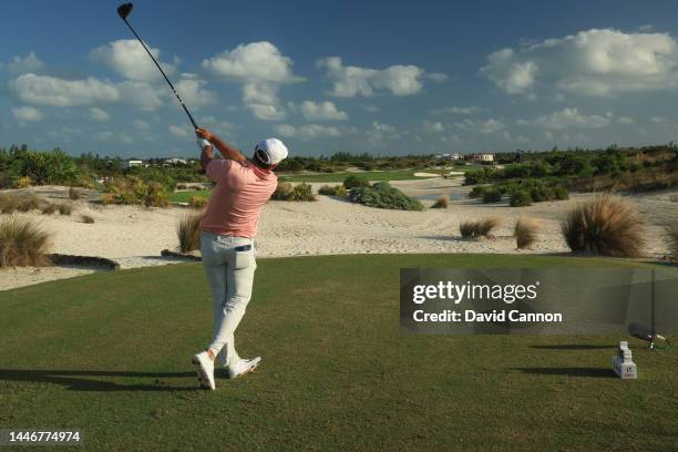 Scottie Scheffler of The United States plays his tee shot on the 16th hole during the final round of the 2022 Hero World Challenge at Albany Golf...