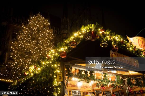 Visitors walk among stalls selling Christmas decorations, candied nuts, Gluehwein, sausages and other traditional fare on the 2nd weekend of the...