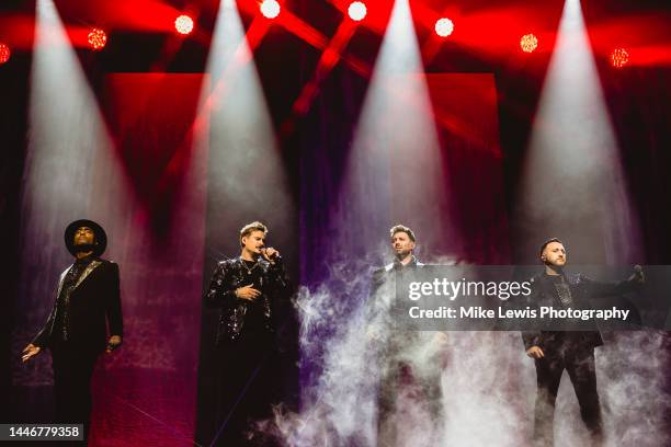 Simon Webbe, Lee Ryan, Duncan James and Antony Costa of Blue perform on stage at Motorpoint Arena Cardiff on December 04, 2022 in Cardiff, Wales.