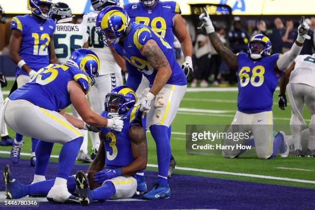 Coleman Shelton of the Los Angeles Rams and Rob Havenstein celebrate alongside Cam Akers after a touchdown in the fourth quarter of the game against...