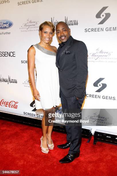 Heather Hayslett and movie producer Will Packer, poses for photos on the red carpet during the Steve & Marjorie Harvey Foundation Gala at Cipriani...