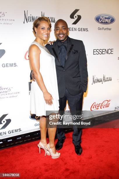 Heather Hayslett and movie producer Will Packer, poses for photos on the red carpet during the Steve & Marjorie Harvey Foundation Gala at Cipriani...