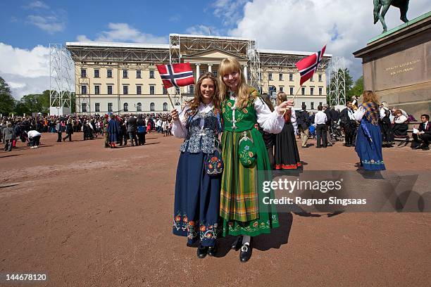 Two girls dressed in Norwegian national costume during Norwegian National day on May 17, 2012 in Oslo, Norway.