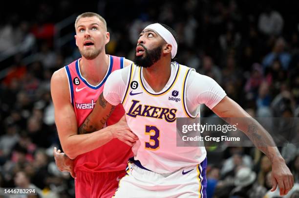 Kristaps Porzingis of the Washington Wizards defends Anthony Davis of the Los Angeles Lakers in the second quarter of the game at Capital One Arena...