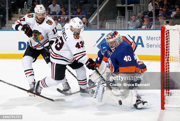Semyon Varlamov of the New York Islanders makes the first period save on Colin Blackwell of the Chicago Blackhawks at the UBS Arena on December 04,...