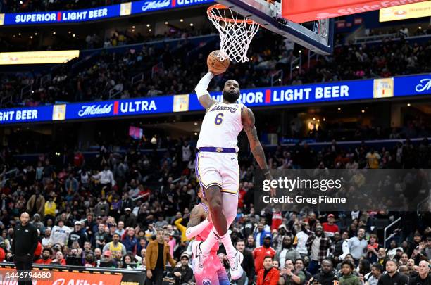 LeBron James of the Los Angeles Lakers dunks the ball in the fourth quarter of the game against the Washington Wizards at Capital One Arena on...