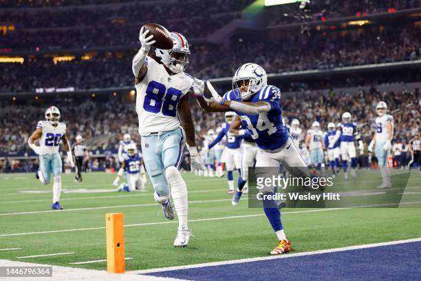 CeeDee Lamb of the Dallas Cowboys scores a touchdown as Isaiah Rodgers of the Indianapolis Colts defends in the first quarter at AT&T Stadium on...