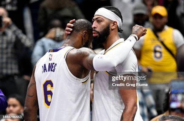 Anthony Davis and LeBron James of the Los Angeles Lakers celebrate after a 130-119 victory against the Washington Wizards at Capital One Arena on...