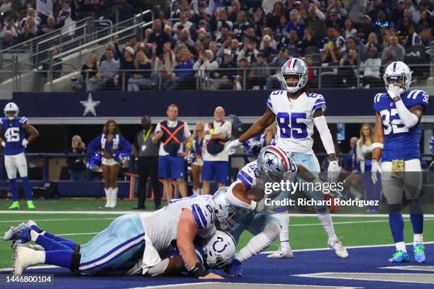 Tony Pollard of the Dallas Cowboys scores a touchdown in the second quarter of a game against the Indianapolis Colts at AT&T Stadium on December 04,...