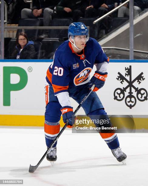 Hudson Fasching of the New York Islanders skates against the Chicago Blackhawks during the second period at the UBS Arena on December 04, 2022 in...