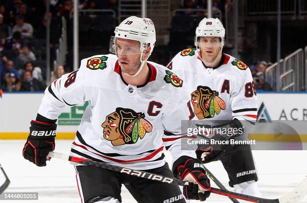 Jonathan Toews and Patrick Kane of the Chicago Blackhawks skates against the New York Islanders during the second period at the UBS Arena on December...