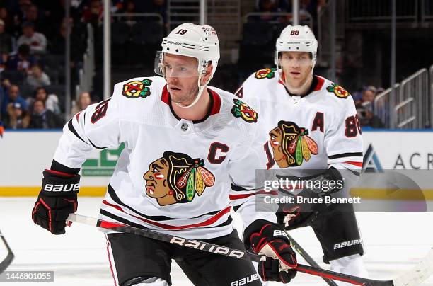 Jonathan Toews and Patrick Kane of the Chicago Blackhawks skates against the New York Islanders during the second period at the UBS Arena on December...