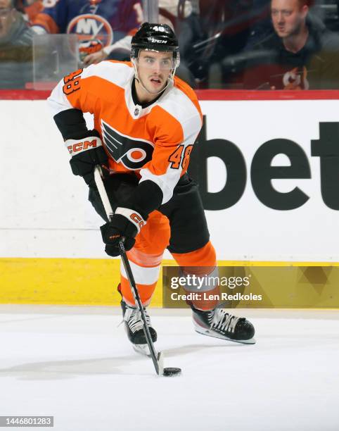 Morgan Frost of the Philadelphia Flyers skates the puck against the New York Islanders at the Wells Fargo Center on November 29, 2022 in...