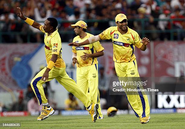 Chennai Super Kings bowler Dwayne Bravo celebrates with teammates after the dismissal of Kings XI Punjab batsman David Hussey during IPL Twenty 20...