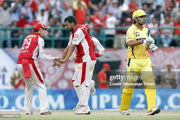 Kings XI Punjab bowler Parveen Kumar celebrates with teammates after the dismissal of Chennai Super Kings batsman Murali Vijay during IPL Twenty 20...