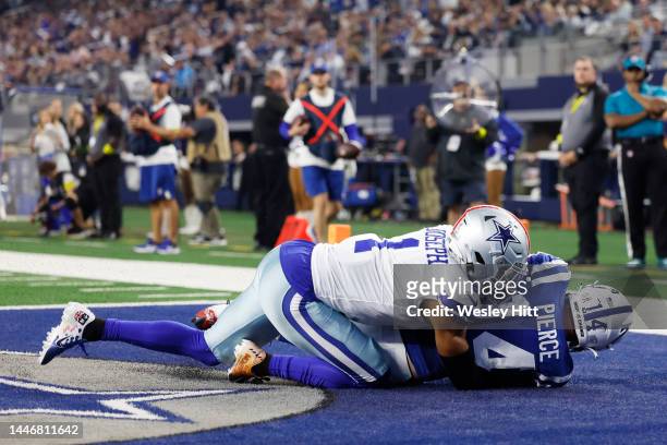 Alec Pierce of the Indianapolis Colts catches a touchdown as Kelvin Joseph of the Dallas Cowboys takes him to the ground in the third quarter at AT&T...