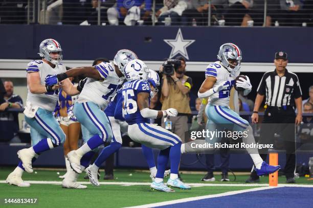 Tony Pollard of the Dallas Cowboys scores a touchdown in the fourth quarter of a game against the Indianapolis Colts at AT&T Stadium on December 04,...