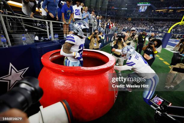 Ezekiel Elliott celebrates a touchdown with Dak Prescott of the Dallas Cowboys in the fourth quarter of a game against the Indianapolis Colts at AT&T...
