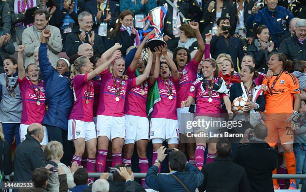 Louisa Necib of Olympique Lyonnais lifts the trophy and celebrates with team mates after winning the UEFA Women's Champions League Final at...