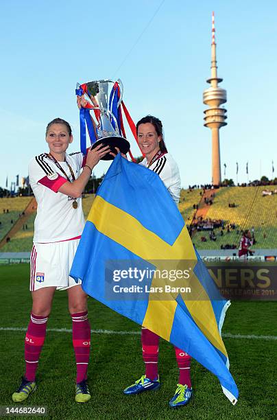 Lotta Schelin of Olympique Lyonnais celebrates with team mate Corine Franco after winning the UEFA Women's Champions League Final at Olympiastadion...