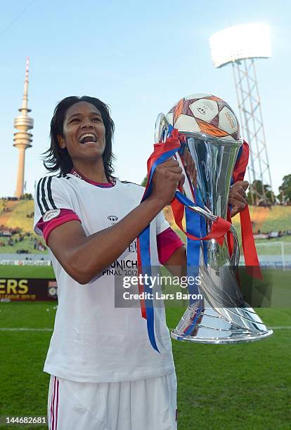 Wendie Renard of Olympique Lyonnais celebrates with the trophy after winning the UEFA Women's Champions League Final at Olympiastadion on May 17,...