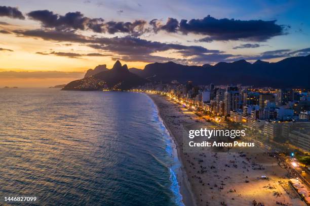 panorama of rio de janeiro at twilight, brazil. ipanema beach at sunset. rio de janeiro - copacabana beach stock pictures, royalty-free photos & images