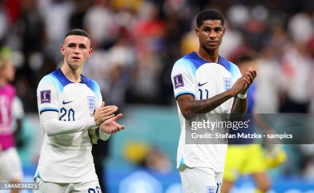 Phil Foden of England and Marcus Rashford of England celebrate with the fans after their sides victory the FIFA World Cup Qatar 2022 Round of 16...
